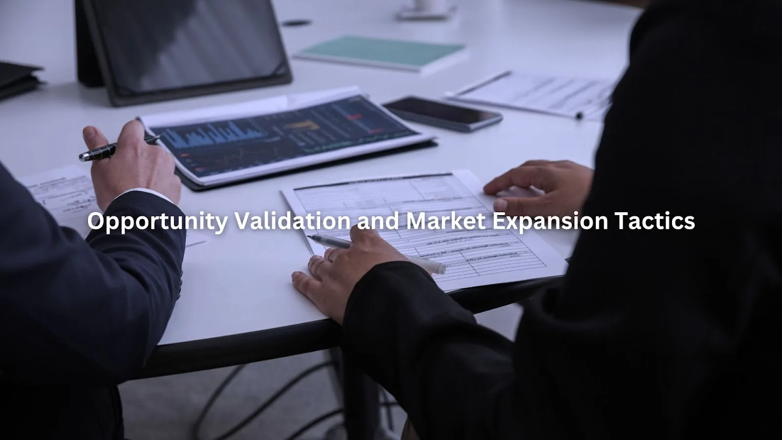 Businessman analyzing market data and planning business expansion strategies on digital tablet and documents.
