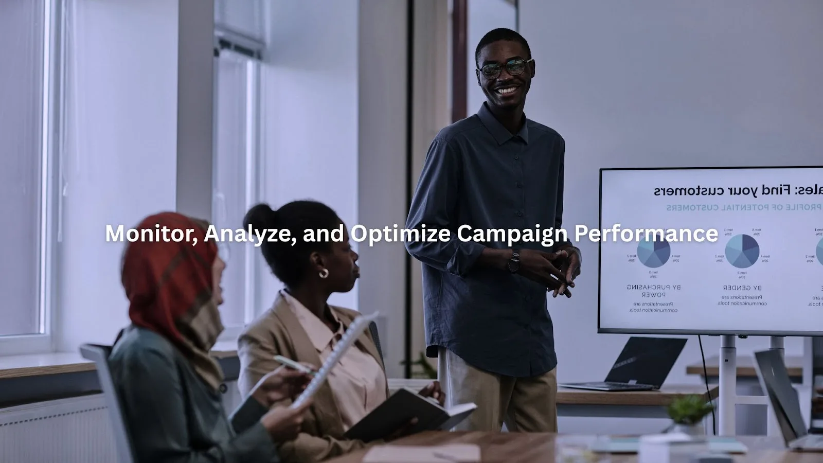 A group of professionals analyzing marketing campaign performance data and discussing strategies to optimize their approach.